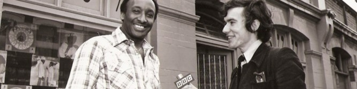 Sonny Roberts being interviewed by a BBC Presenter outside Obitone Record Shop, Station Rd, Harlesden NW10 To select the names of notable Reggae Musicians/Producers from the 1960s-1990s on commemorative Paving Slabs (e.g., like the Camden High Street Music Walk of Fame or Hollywood in California’s Walk of Fame)